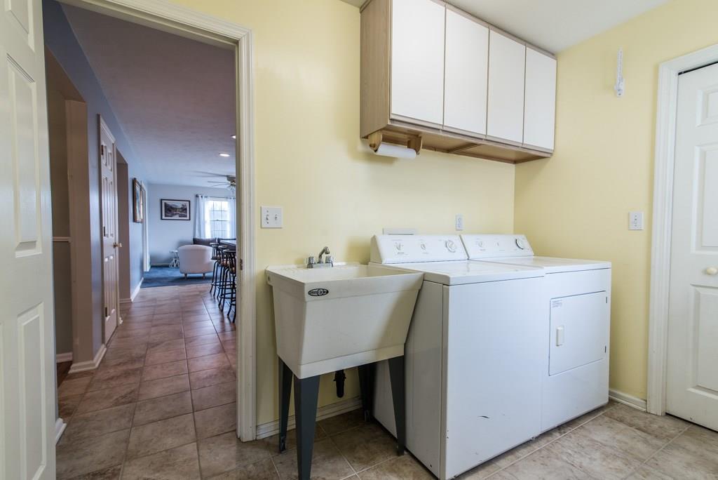225 Logan Road Valencia, PA 16059 - Photo 12 of 25 Walk in from the over-sized 2 car garage and find yourself in the mudroom / laundry room. Too convenient and easy!!!