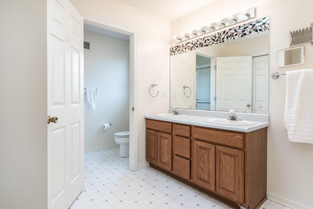 225 Logan Road Valencia, PA 16059 - Photo 16 of 25 Owner's suite bath with double-vanity, new shower. Skylight lets in the natural light!