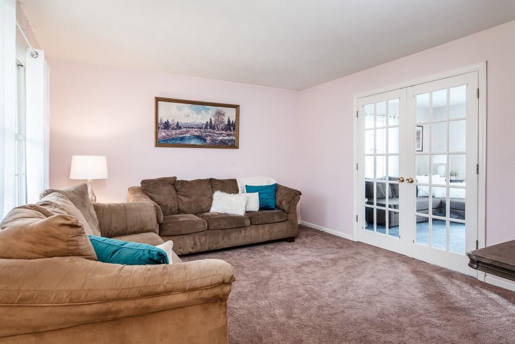 225 Logan Road Valencia, PA 16059 - Photo 9 of 25 The cozy living room reaps the benefits of beaming natural light!
