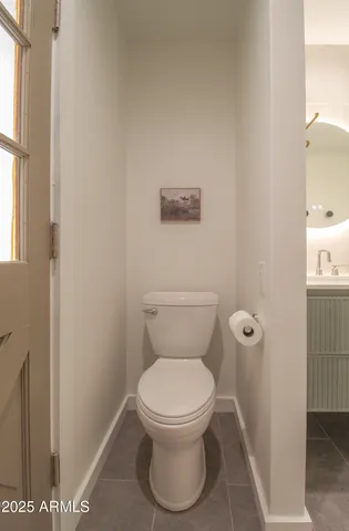 a view of a hallway with a table and a potted plant