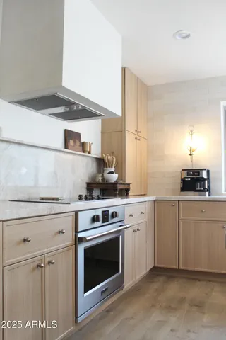 a room with a black white checkered floor with a gaming machine and dining table