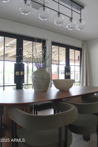 a view of a dining room with furniture window and outside view