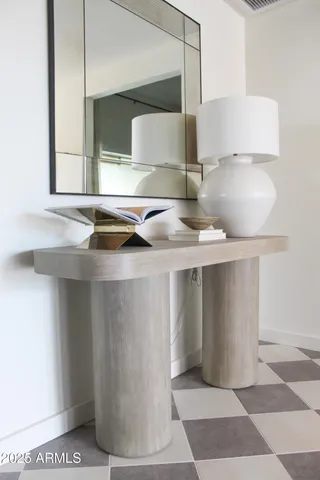 a bedroom with a bed and a mirror