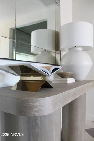 a bathroom with a granite countertop sink mirror and double