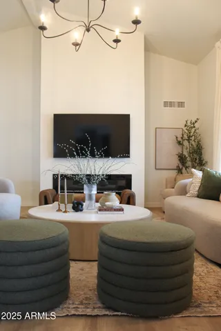 swimming pool view with a seating space and a garden view