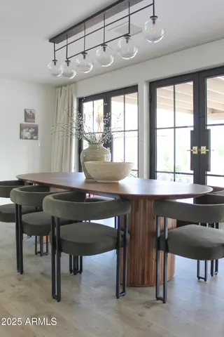 a view of a dining room with furniture and window