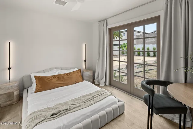 a kitchen with stainless steel appliances granite countertop a sink a microwave a refrigerator and a stove