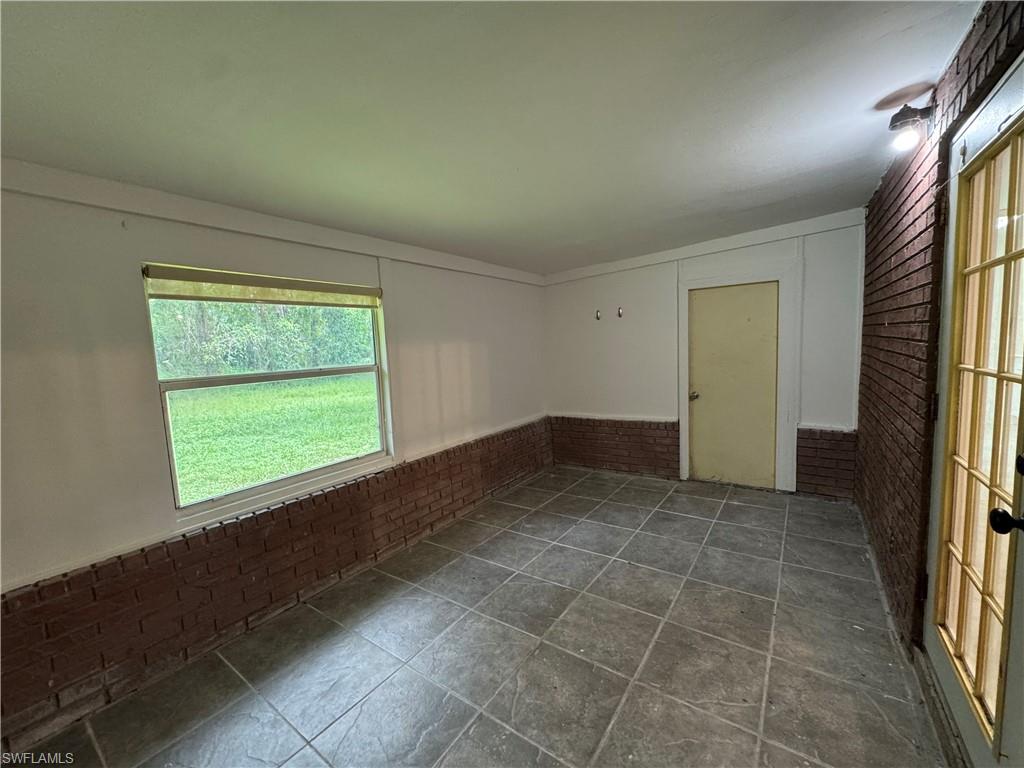 221 18th Avenue Northwest Naples, FL 34120 - Photo 21 of 22 a view of an empty room with a window