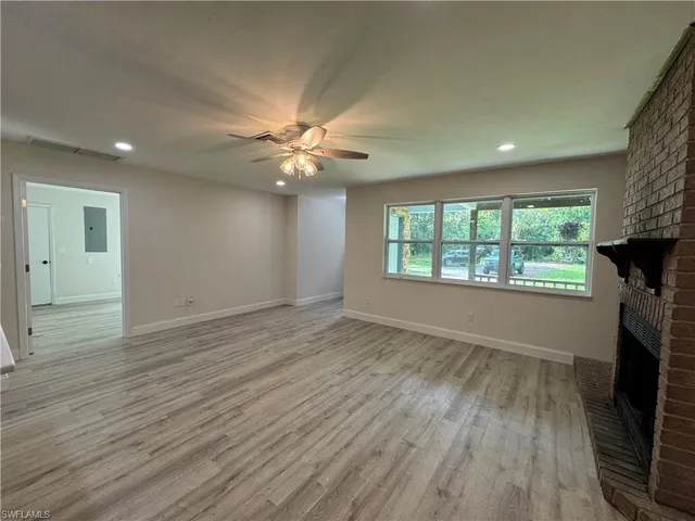 a kitchen with a sink appliances and a large window