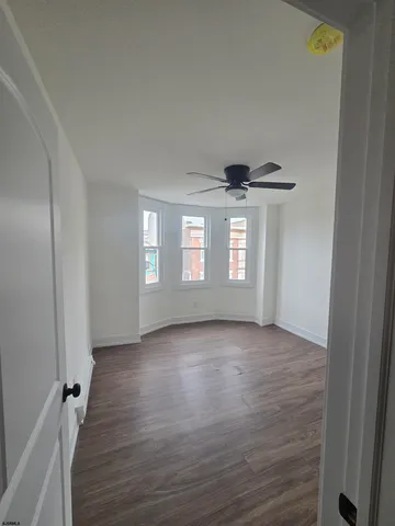 a view of livingroom with hardwood floor and window