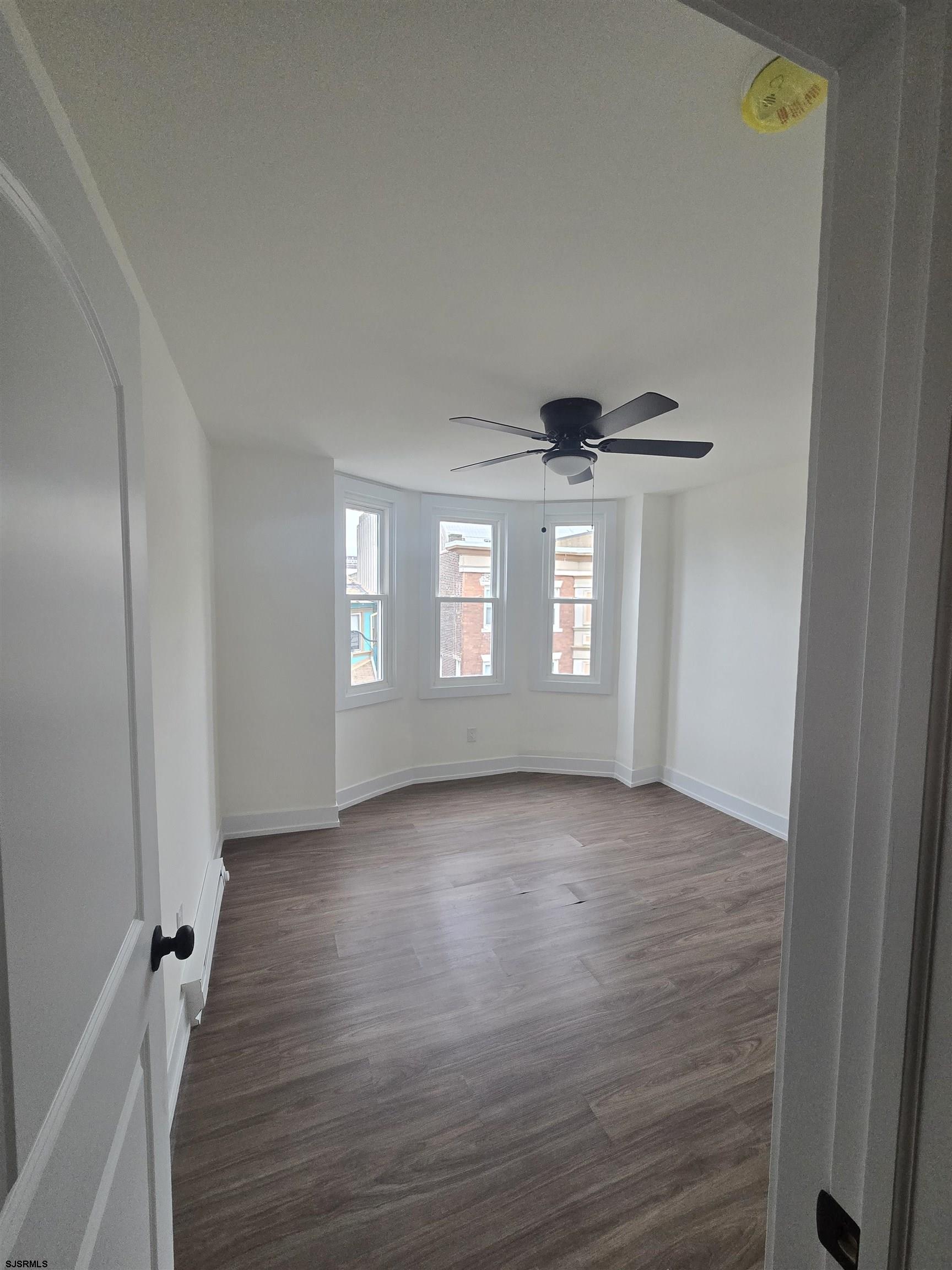 2501 Pacific Avenue, Unit 202 Atlantic City, NJ 08401 - Photo 3 of 4 a view of livingroom with hardwood floor and window