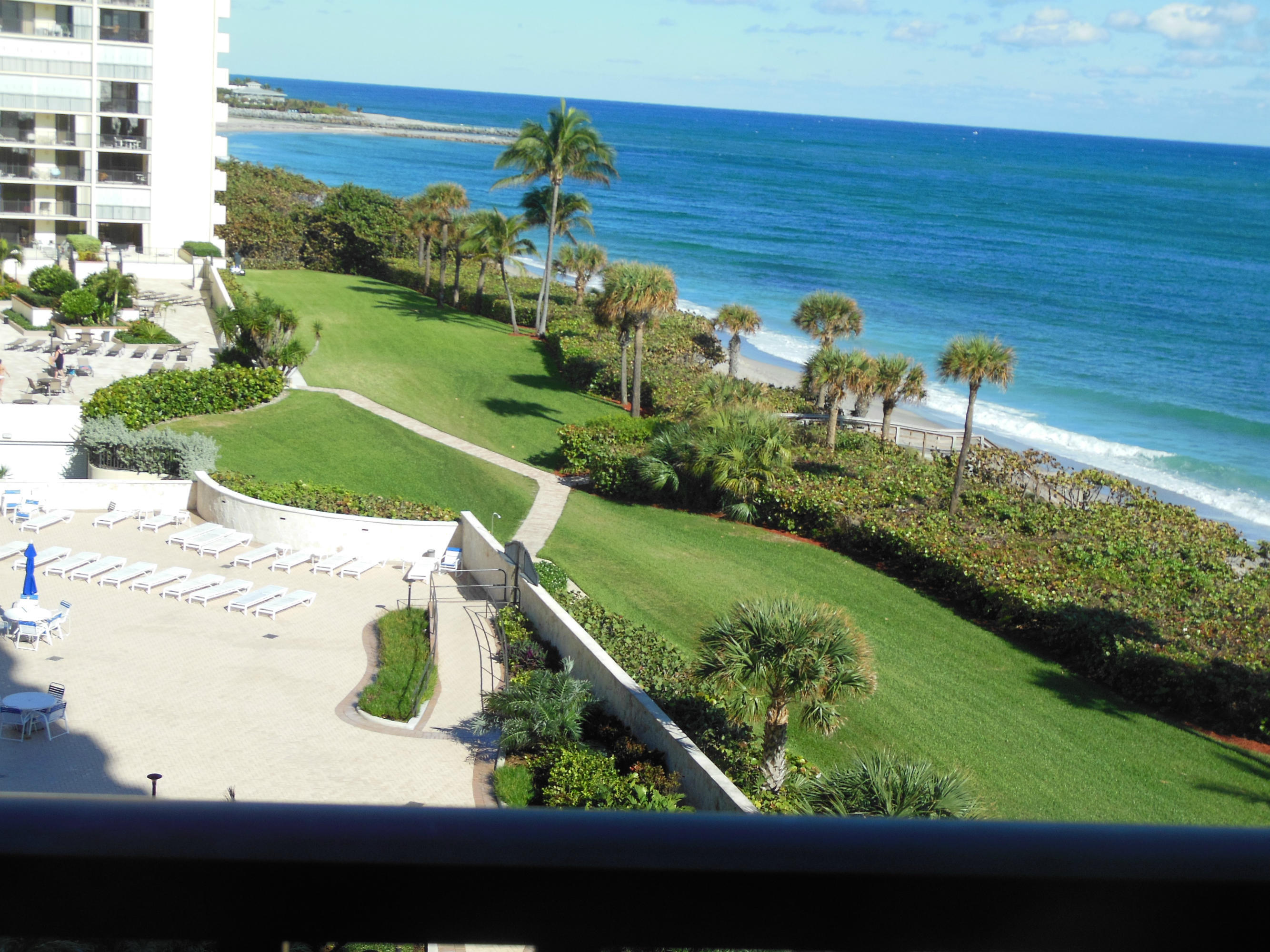 300 Ocean Trail Way, Unit 602 Jupiter, FL 33477 - Photo 1 of 17 a view of a swimming pool with an outdoor space