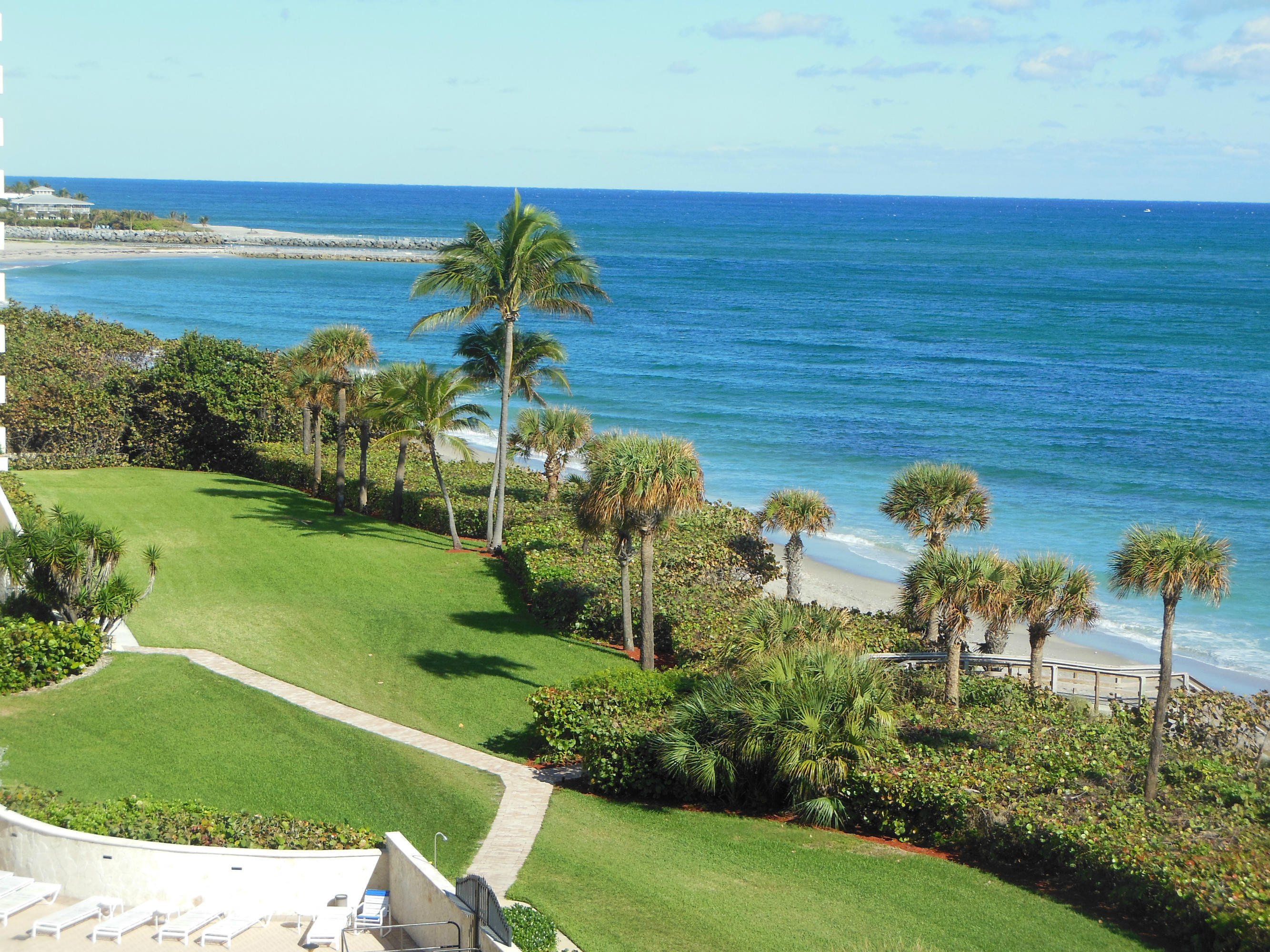 300 Ocean Trail Way, Unit 602 Jupiter, FL 33477 - Photo 11 of 17 a view of a garden with lawn chairs