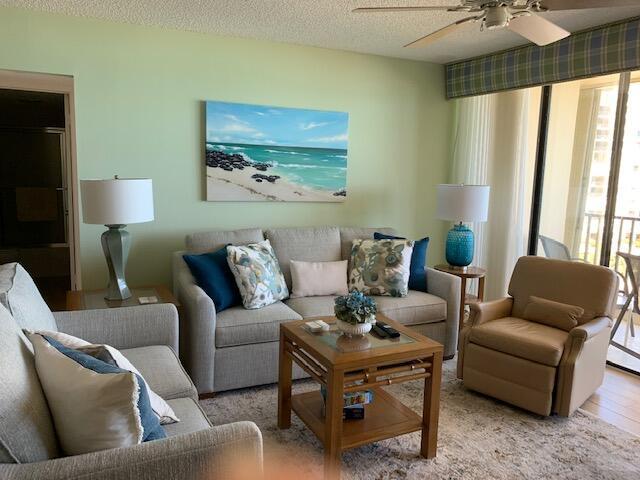 300 Ocean Trail Way, Unit 602 Jupiter, FL 33477 - Photo 4 of 17 a living room with furniture and a large window