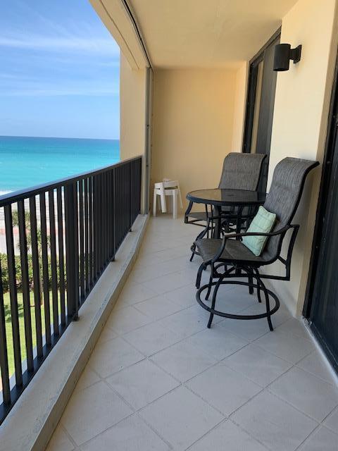 300 Ocean Trail Way, Unit 602 Jupiter, FL 33477 - Photo 9 of 17 a view of balcony with chairs and wooden fence