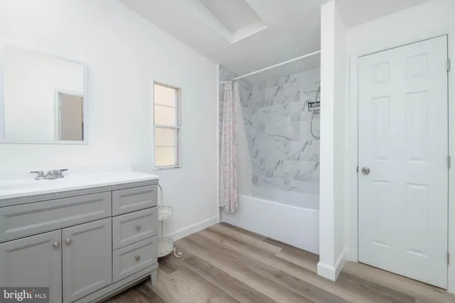 a bathroom with a bathtub and a sink