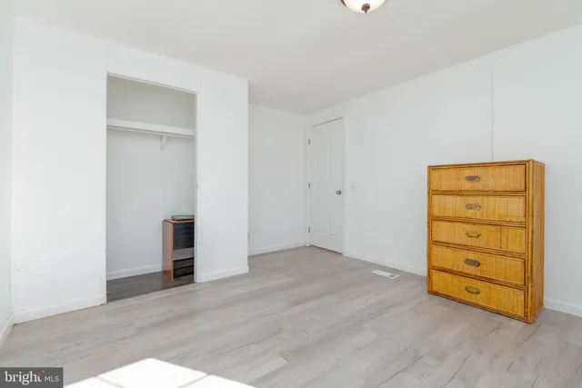 an empty room with wooden floor