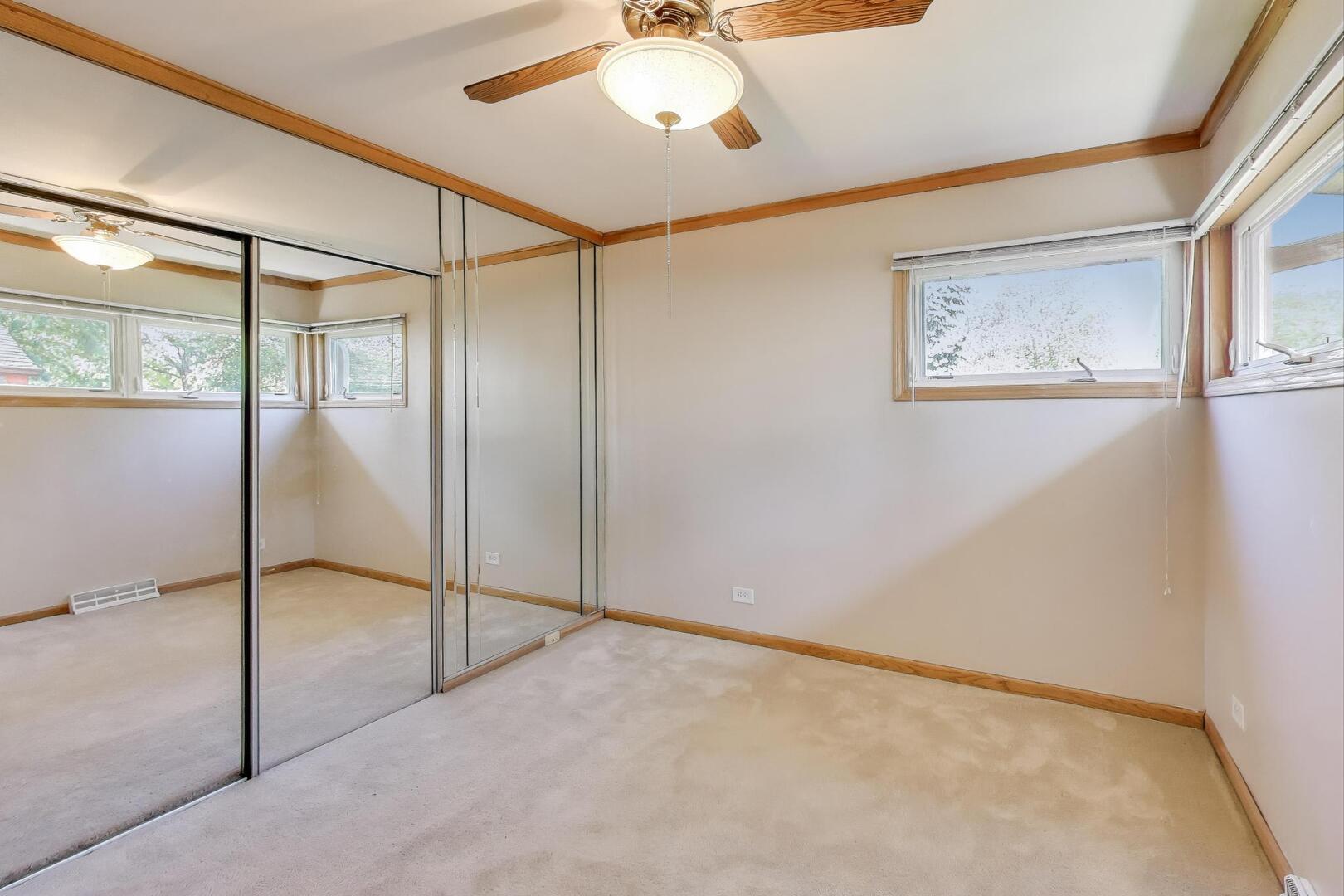 828 Dell Road Northbrook, IL 60062 - Photo 14 of 37 a view of an empty room with a window