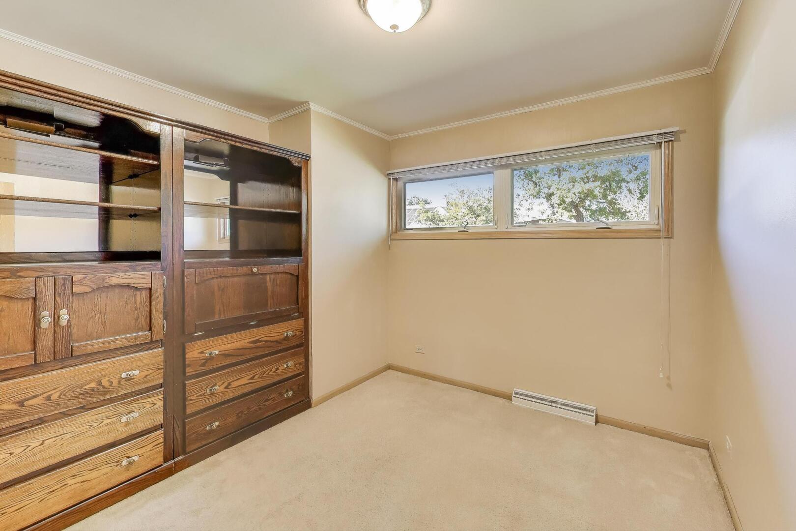 828 Dell Road Northbrook, IL 60062 - Photo 16 of 37 a view of walk in closet with empty racks