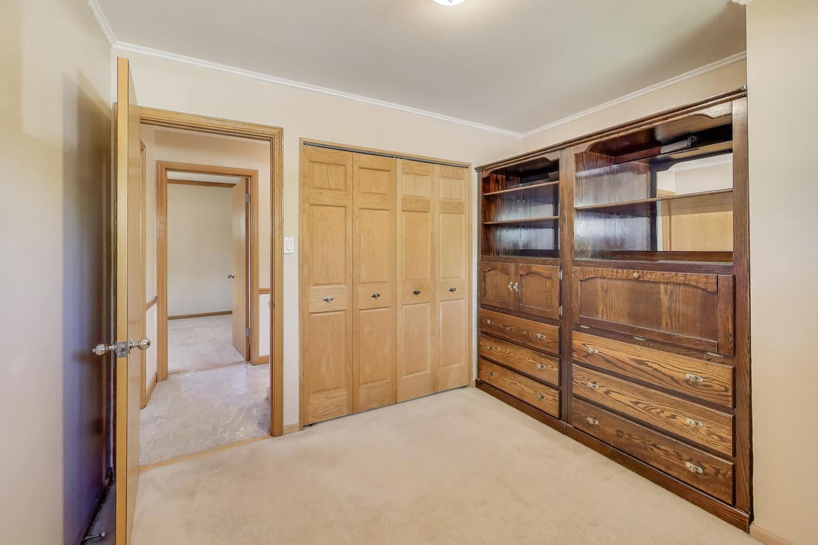 828 Dell Road Northbrook, IL 60062 - Photo 17 of 37 a big room with closet and wooden shelves