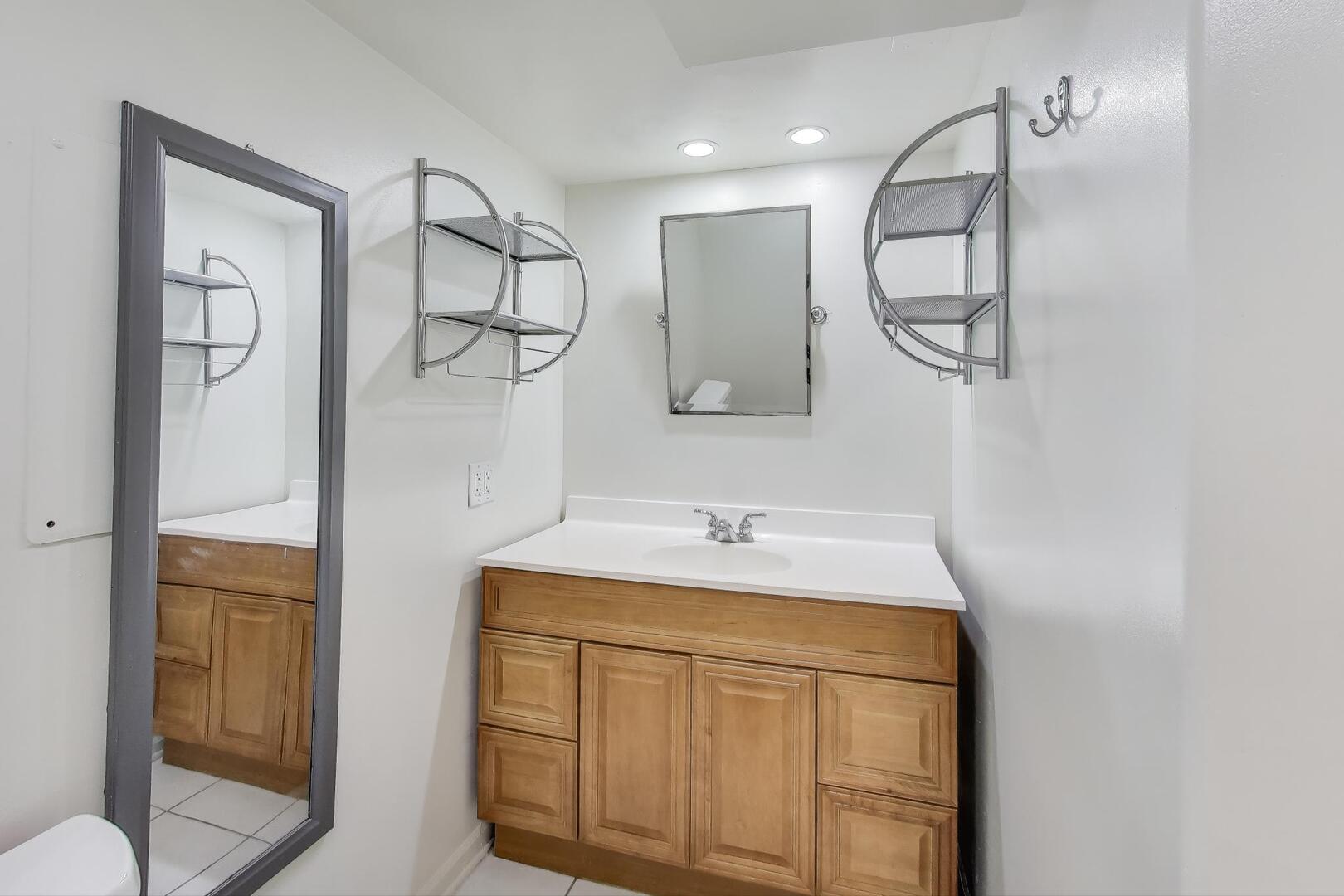 828 Dell Road Northbrook, IL 60062 - Photo 24 of 37 a bathroom with a sink and a mirror