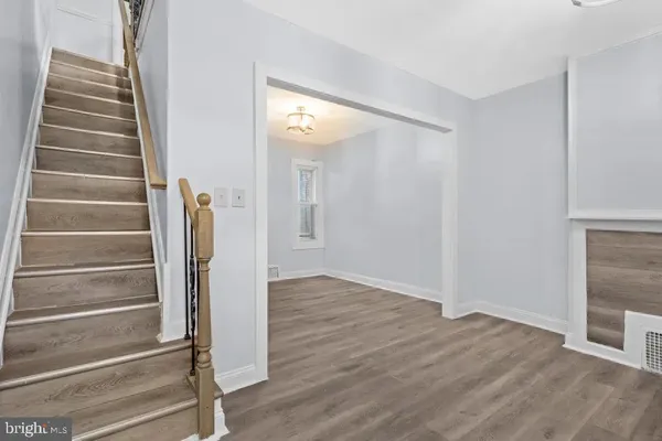 a view of an entryway with wooden floor
