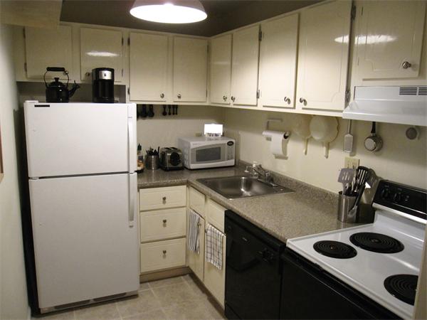 72 Barrett Street, Unit 312 Northampton, MA 01060 - Photo 4 of 7 a kitchen with a sink a refrigerator and cabinets