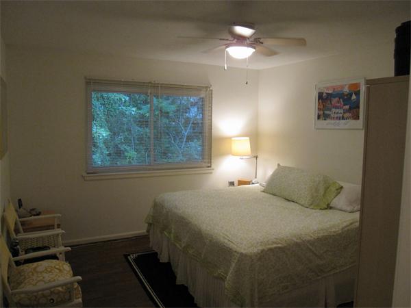 72 Barrett Street, Unit 312 Northampton, MA 01060 - Photo 6 of 7 a bedroom with a bed and a chandelier