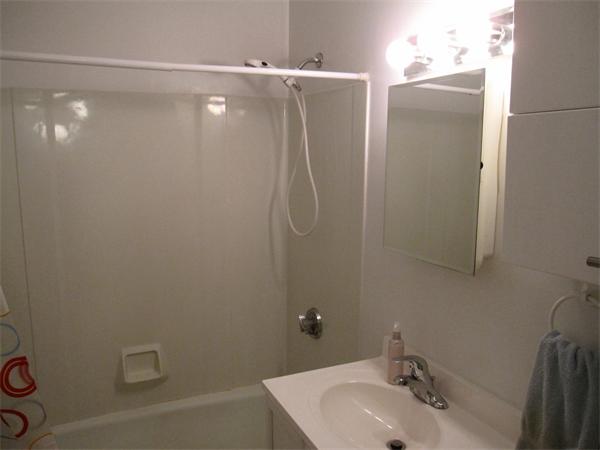 72 Barrett Street, Unit 312 Northampton, MA 01060 - Photo 7 of 7 a bathroom with a sink and a mirror