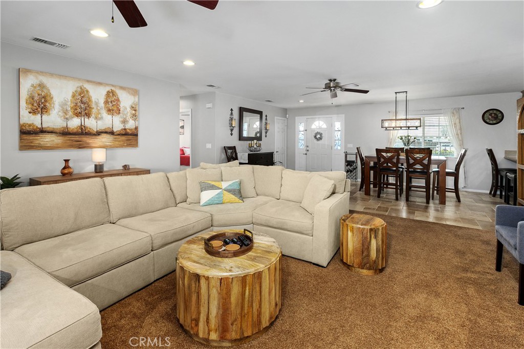 34990 County Line Road Yucaipa, CA 92399 - Photo 12 of 51 a living room with furniture and a kitchen