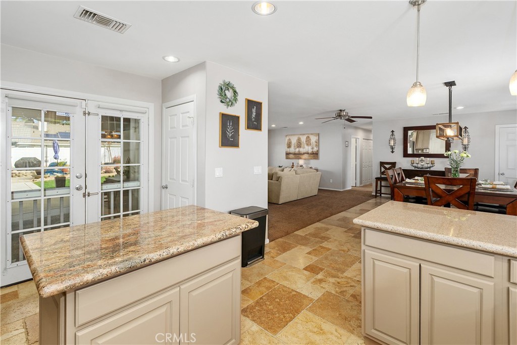 34990 County Line Road Yucaipa, CA 92399 - Photo 19 of 51 a kitchen with stainless steel appliances granite countertop a sink dishwasher and a wooden cabinets