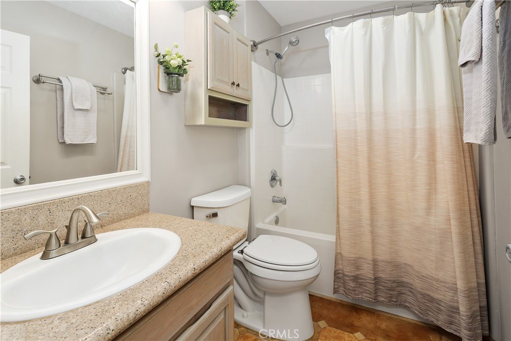 34990 County Line Road Yucaipa, CA 92399 - Photo 22 of 51 a bathroom with a granite countertop sink toilet and shower