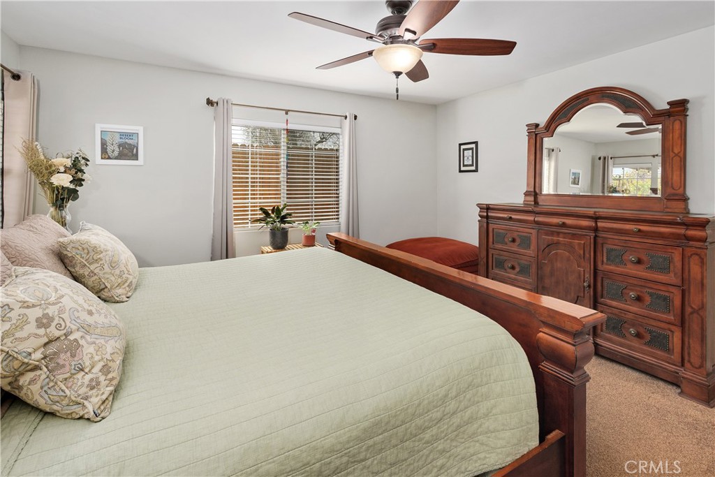 34990 County Line Road Yucaipa, CA 92399 - Photo 24 of 51 a bedroom with a large bed and wooden floor