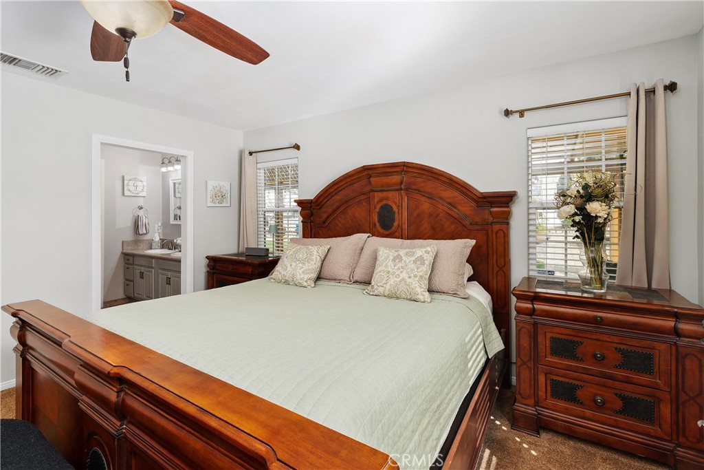 34990 County Line Road Yucaipa, CA 92399 - Photo 25 of 51 a bedroom with a bed and a dresser