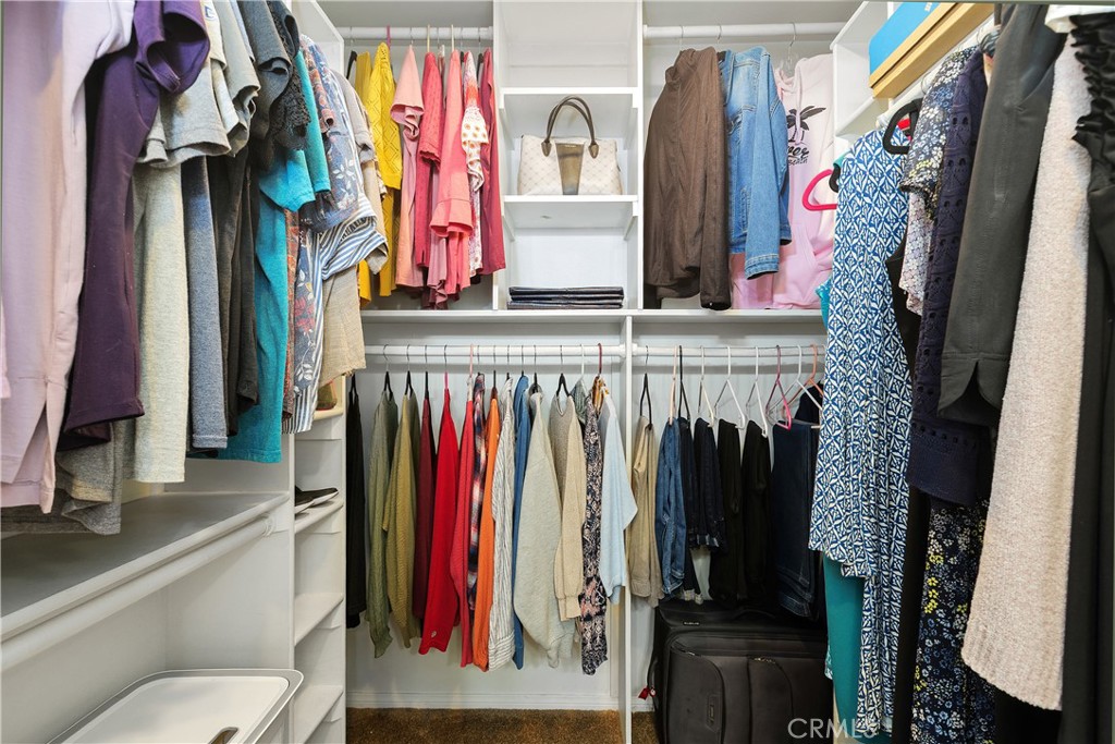 34990 County Line Road Yucaipa, CA 92399 - Photo 28 of 51 a view of walk in closet with clothes