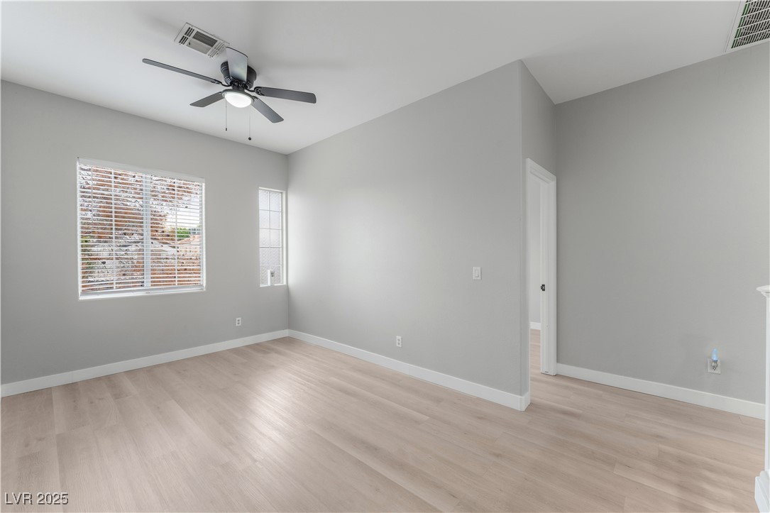 3695 Funston Way Las Vegas, NV 89129 - Photo 22 of 43 Empty room featuring light wood-type flooring and ceiling fan