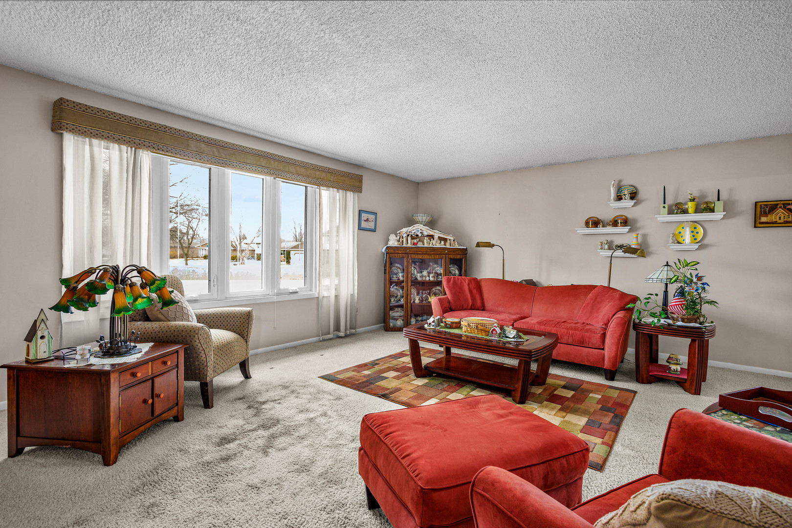 324 Rebecca Road Joliet, IL 60435 - Photo 15 of 31 a living room with furniture a flat screen tv and a window