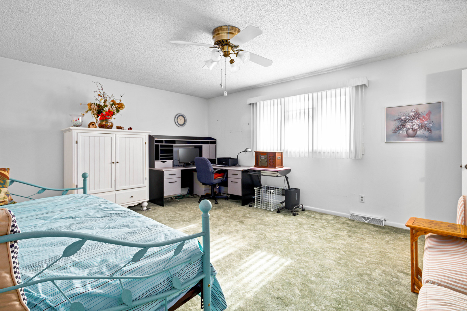 324 Rebecca Road Joliet, IL 60435 - Photo 26 of 31 a bed room with furniture and a chandelier