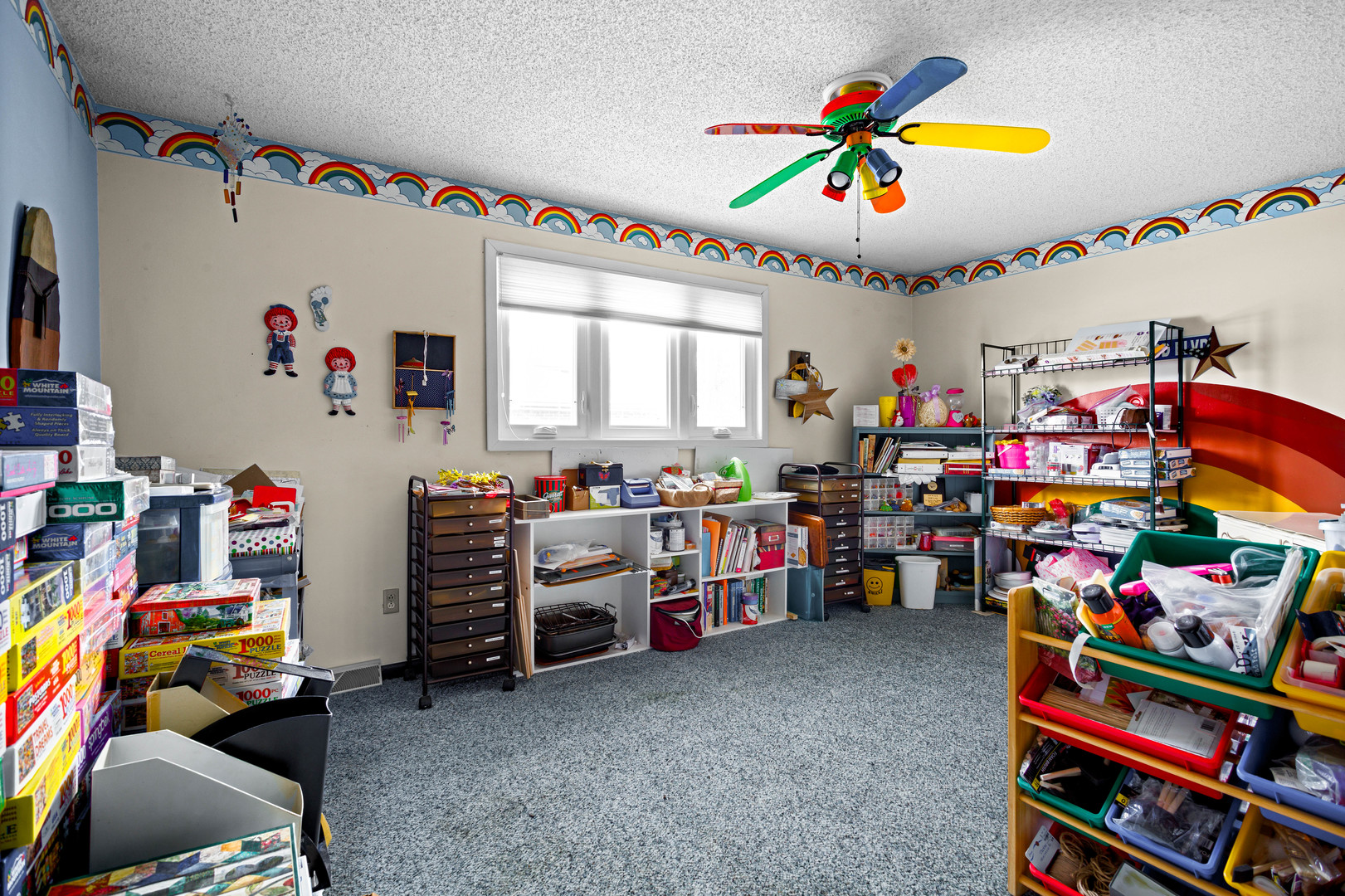 324 Rebecca Road Joliet, IL 60435 - Photo 27 of 31 a children room with toys and a fan