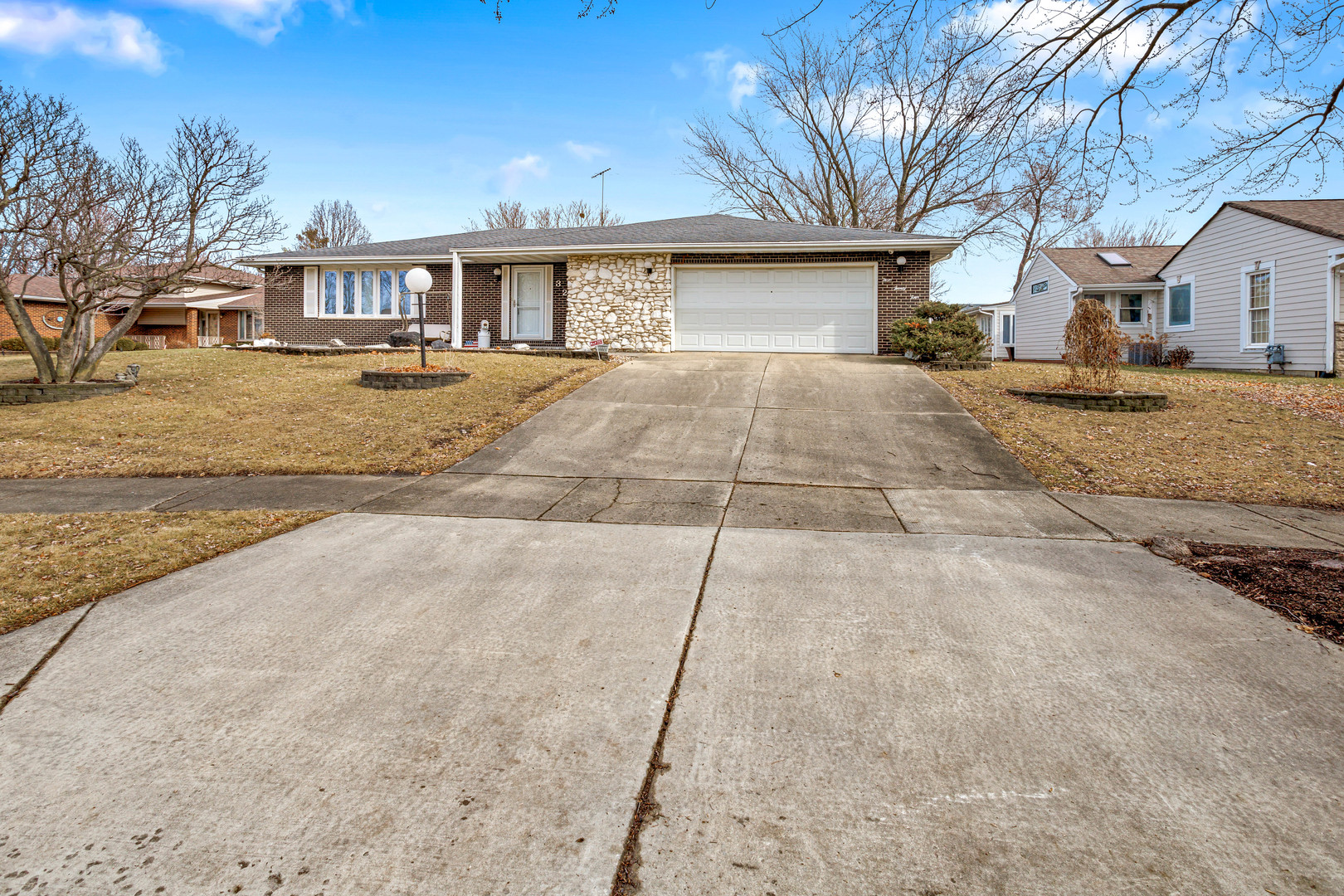 324 Rebecca Road Joliet, IL 60435 - Photo 4 of 31 a front view of a house with a yard