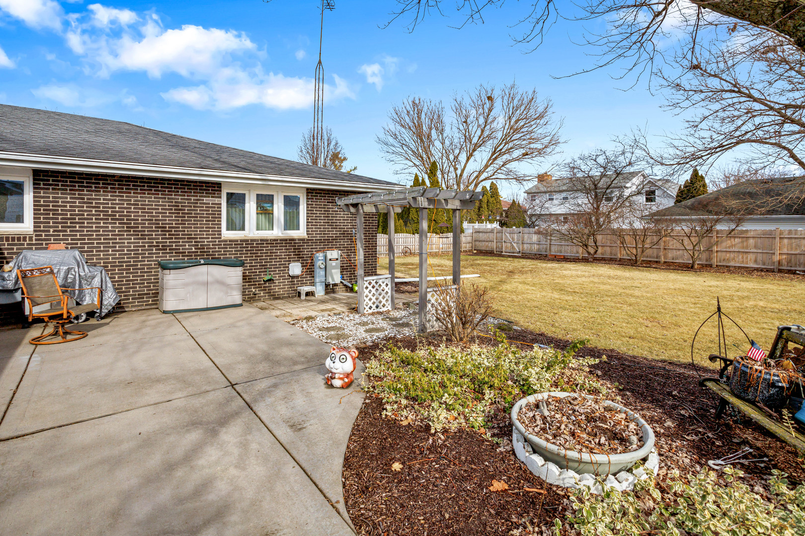 324 Rebecca Road Joliet, IL 60435 - Photo 7 of 31 a view of a backyard with couches chair and fire pit