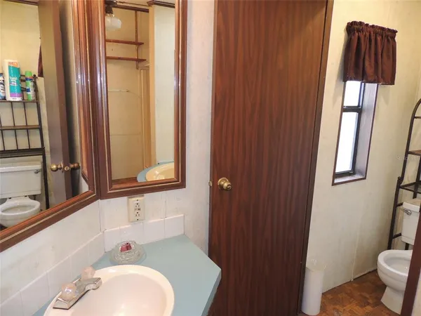 a bathroom with a tub and a sink