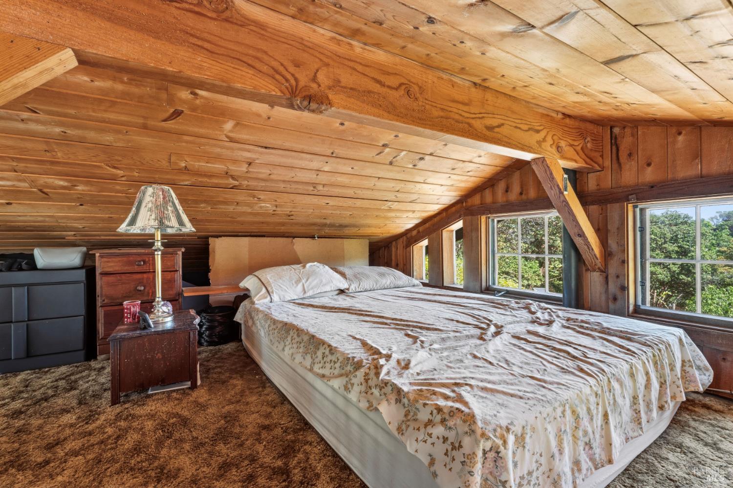 3751 Low Gap Road Ukiah, CA 95482 - Photo 9 of 22 a bed sitting in a bedroom next to a window