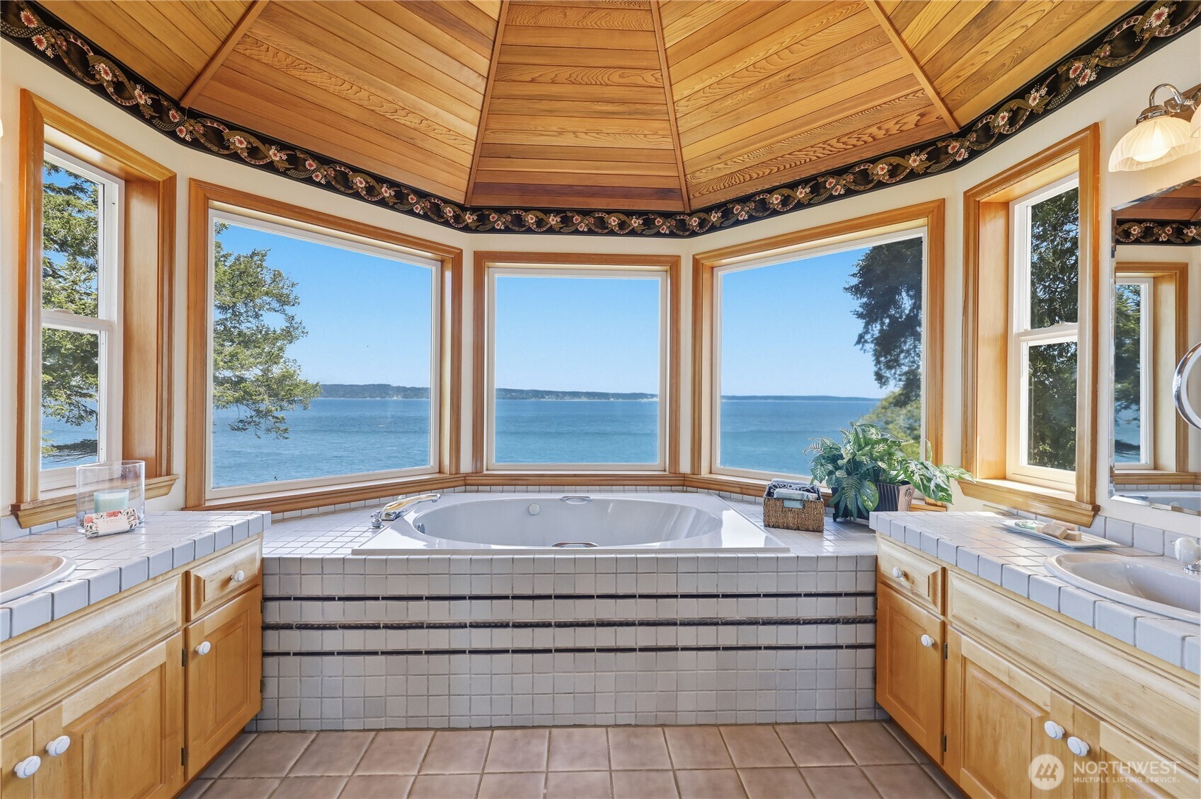 252 Jansen Road Nordland, WA 98358 - Photo 17 of 40 a bathroom with a tub a sink and large window