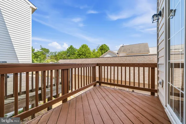 a view of balcony with wooden floor