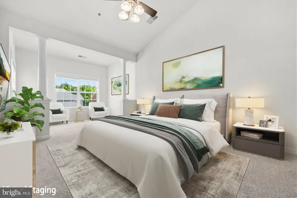 a bedroom with bed and a couch