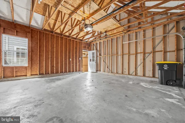 a view of an empty room with a fireplace