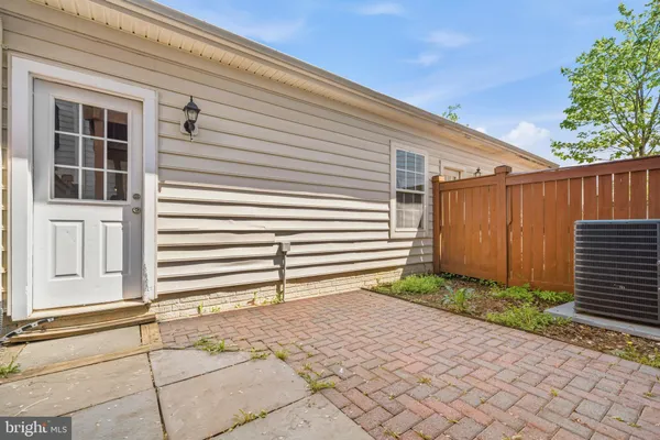 a backyard of a house with plants and trees
