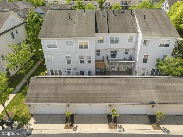 an aerial view of a house with street