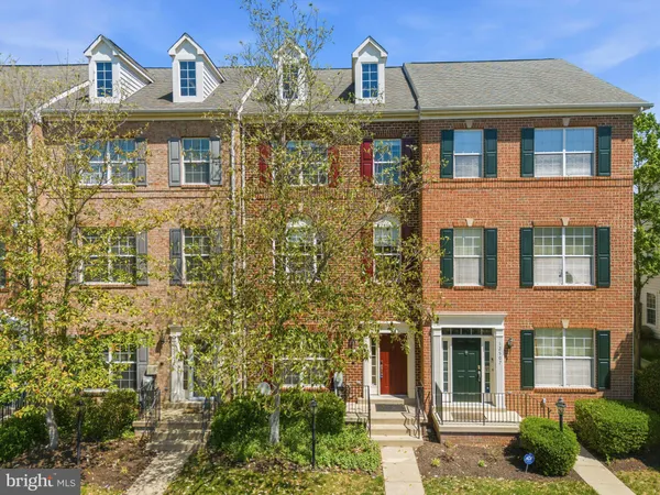 an aerial view of residential houses with yard